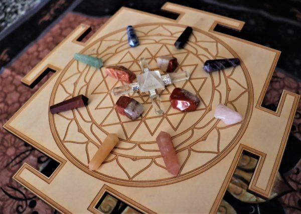 sri yantra crystal grid with crystals displayed angle view