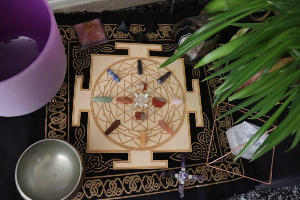 sri yantra mandala crystal grid on display table