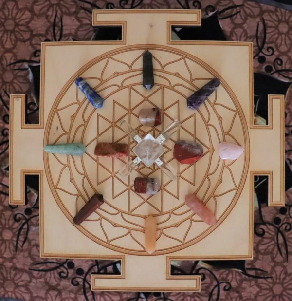 sri yantra mandala crystal grid with crystals displayed