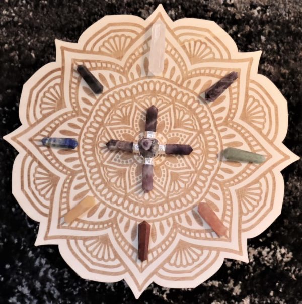 wood crystal grid lotus flower mandala pattern with crystals displayed